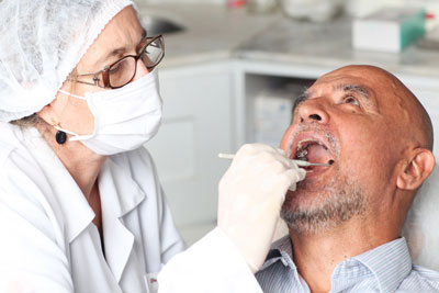 senior receiving dental treatment